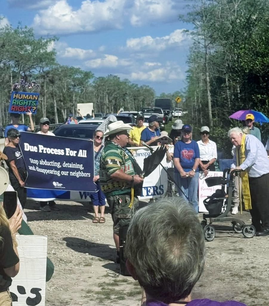 People protesting the immigrant detention center Alligator Alcatraz in Florida.